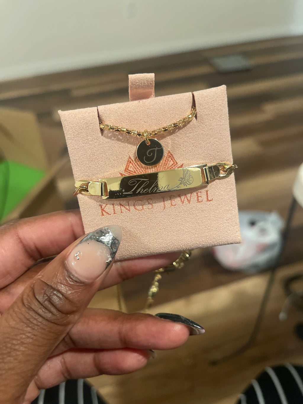 A gold-filled bracelet with custom engraving, displayed on a pink card with 'KING JEWEL' branding.